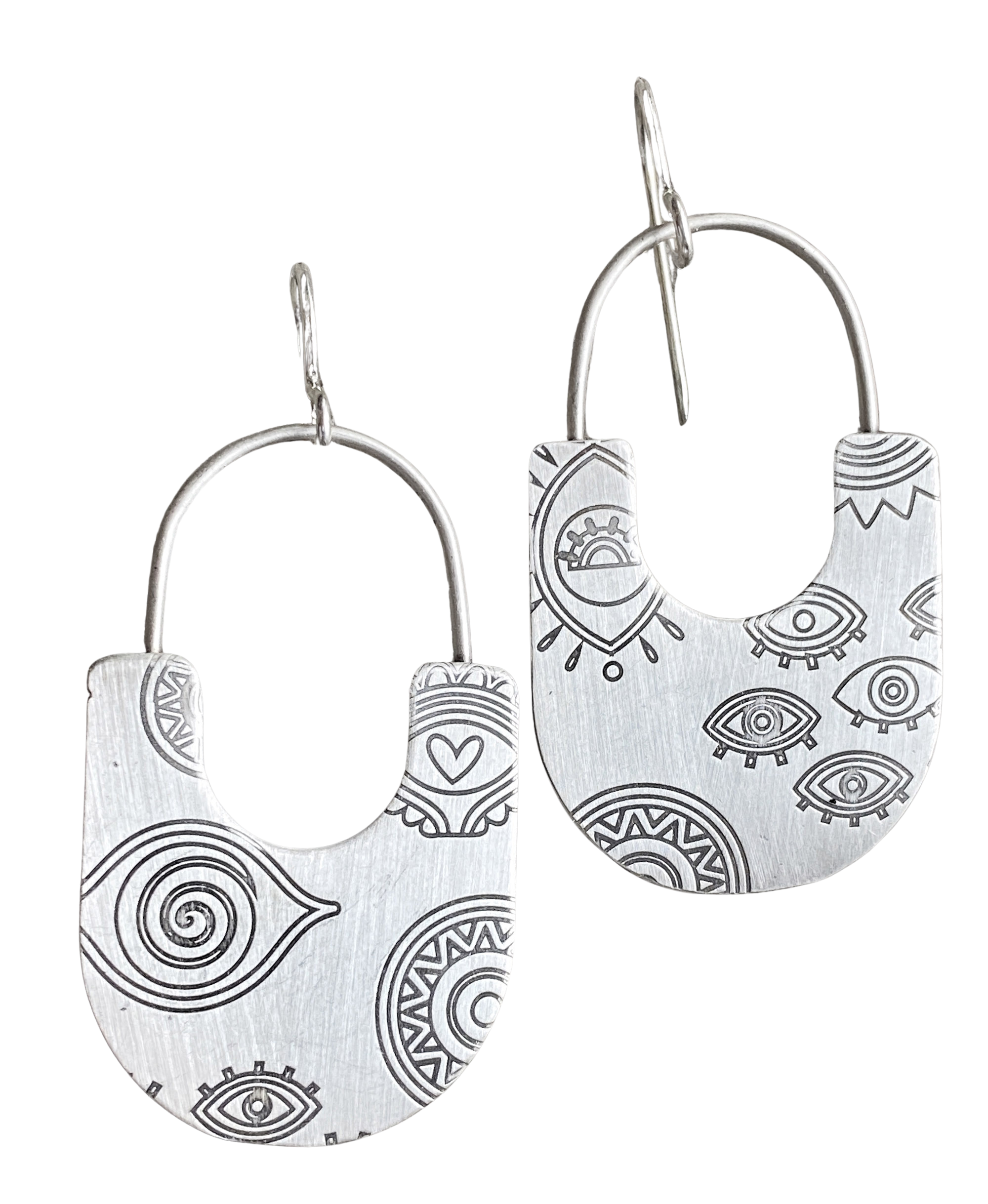 Silver hoop earrings with black geometric patterns on a white background